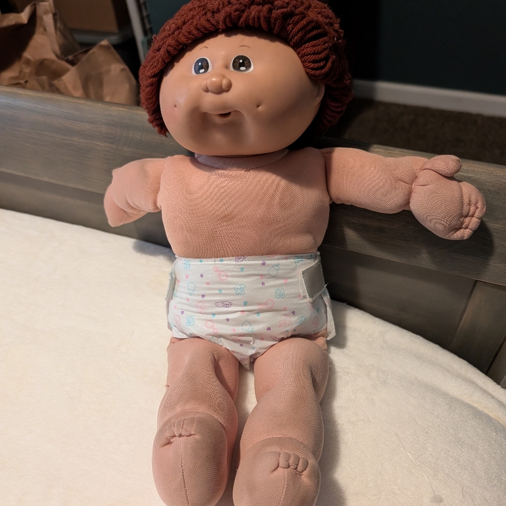 2 Cabbage Patch dolls priced as 1 with several sets of clothes.